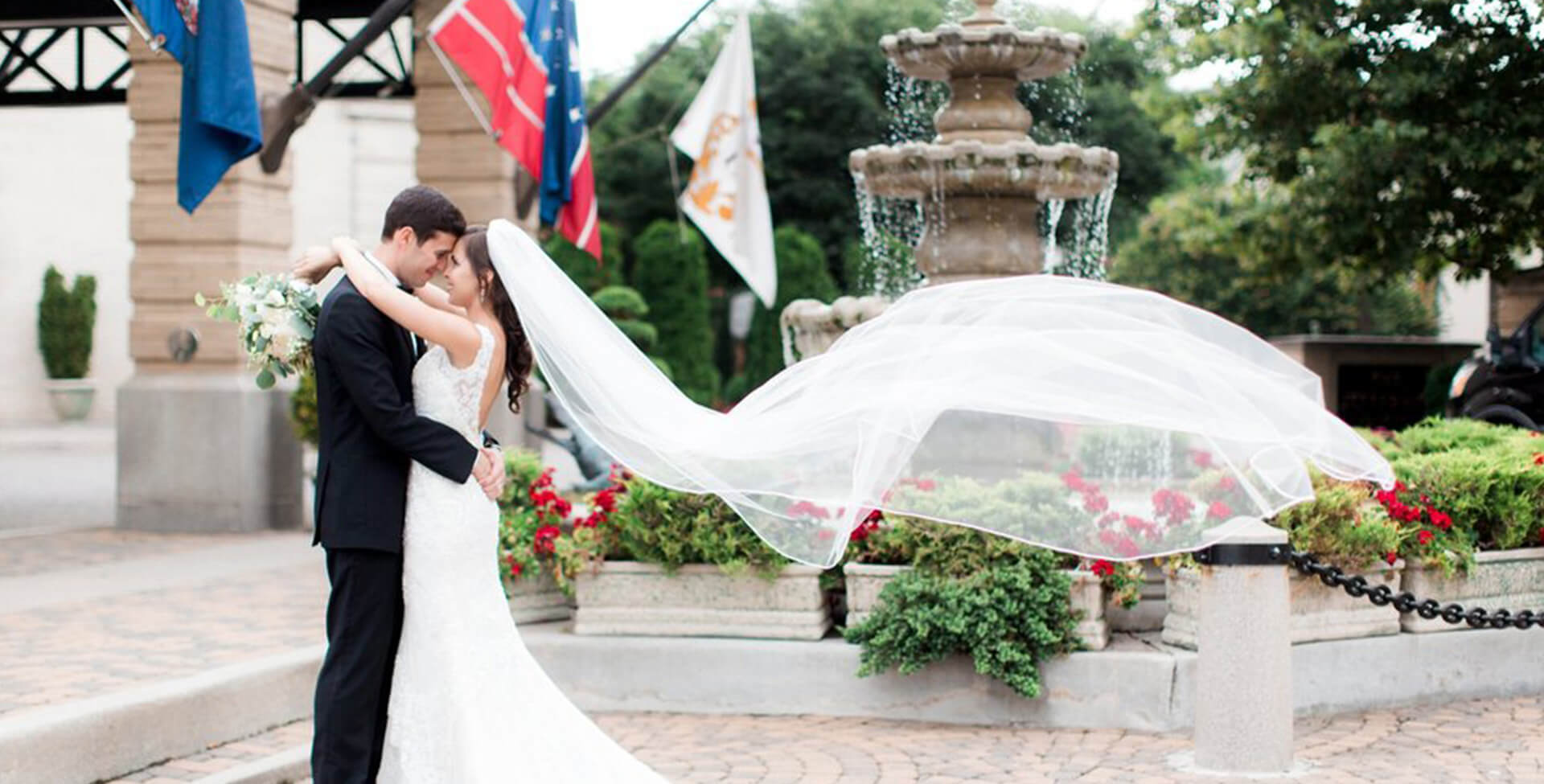 Bride and Groom by fountain